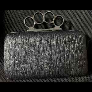 Authentic “Brass-knuckle” purse, black w/silver accents, has some scuffs